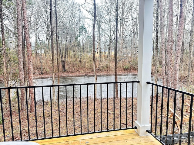 balcony featuring a water view