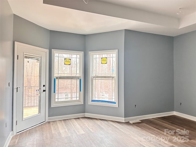 spare room featuring light wood-type flooring