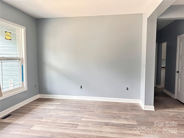 unfurnished room featuring light hardwood / wood-style flooring