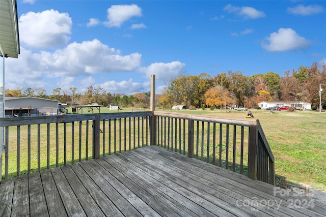 wooden deck with a lawn