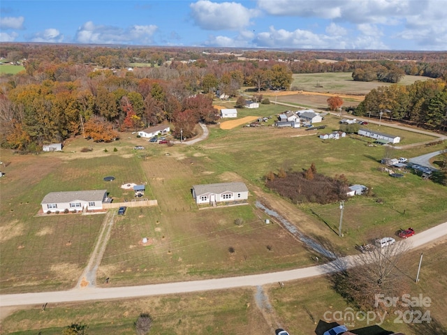 birds eye view of property featuring a rural view