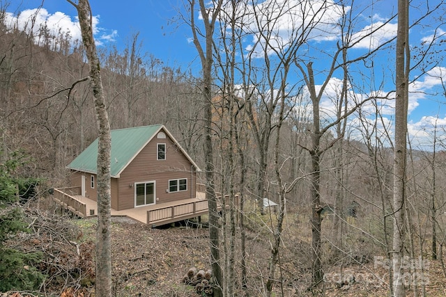 view of property exterior featuring a deck