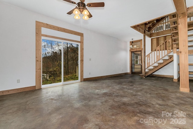 unfurnished living room with ceiling fan