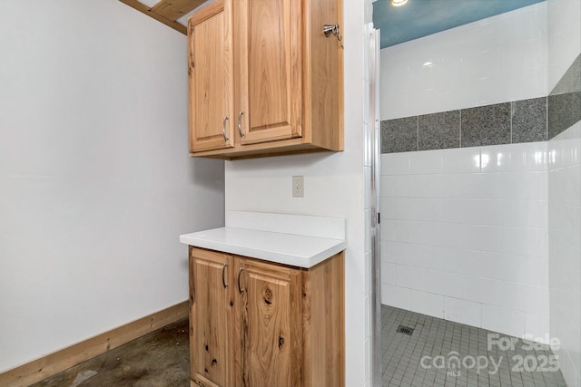 bathroom featuring concrete floors and a shower