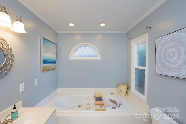 bathroom featuring vanity, toilet, ornamental molding, and tiled tub