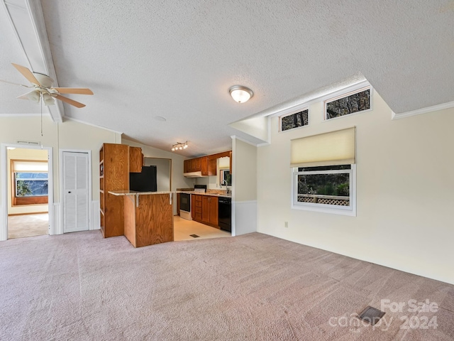 kitchen with light carpet, a kitchen breakfast bar, kitchen peninsula, black appliances, and lofted ceiling