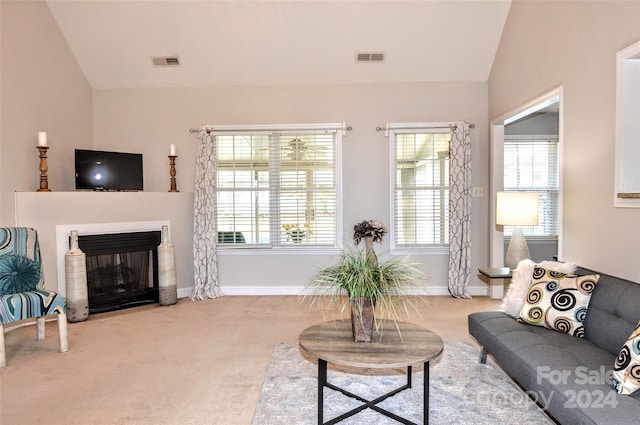 living room with light carpet and lofted ceiling