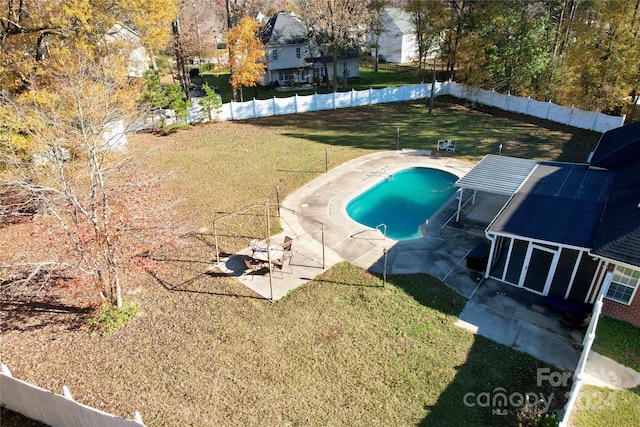 view of pool with a yard and a patio