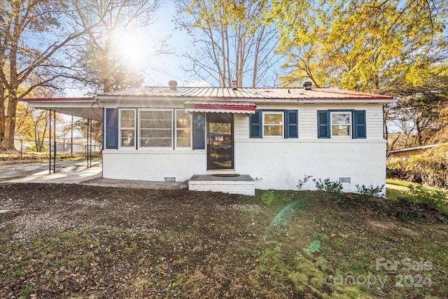 view of front of property with a carport