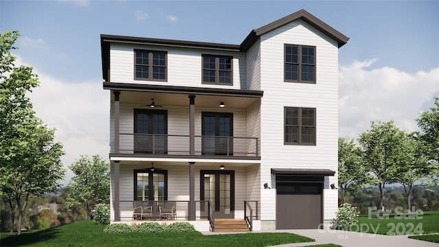 view of front facade featuring ceiling fan, a garage, a balcony, and a front yard