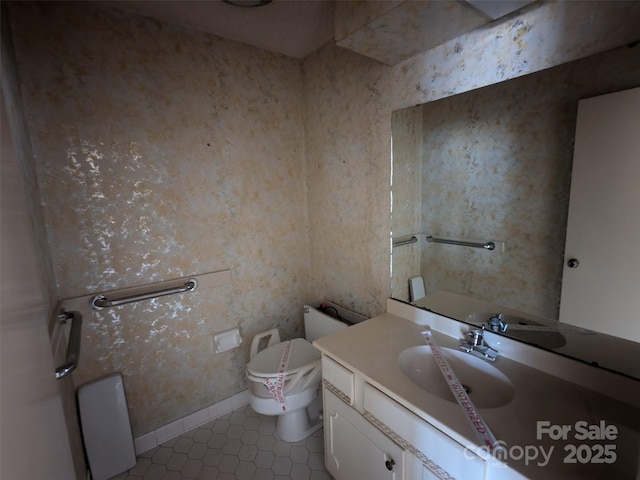 bathroom featuring vanity, tile patterned flooring, and toilet