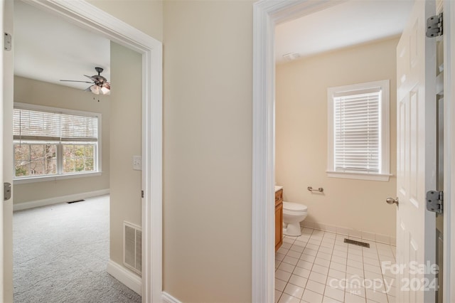 bathroom featuring tile patterned floors, ceiling fan, toilet, and vanity