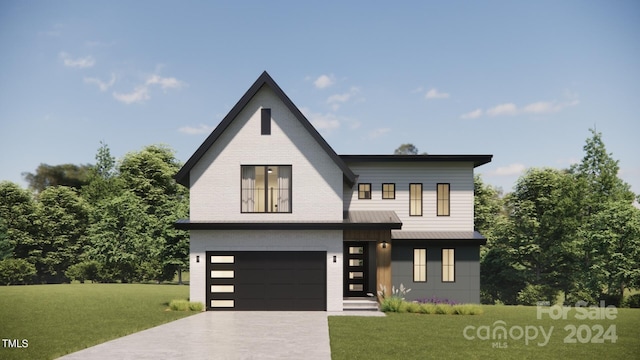 view of front facade with a garage and a front lawn