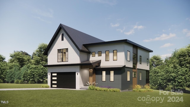 view of front of home with a front yard and a garage