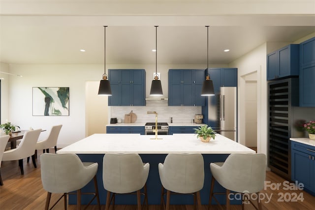 kitchen with dark wood-type flooring, a center island with sink, decorative backsplash, blue cabinetry, and stainless steel appliances