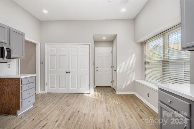 kitchen featuring gray cabinets and light hardwood / wood-style flooring