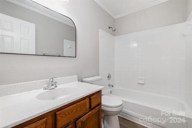 full bathroom featuring vanity, crown molding, toilet, wood-type flooring, and tub / shower combination