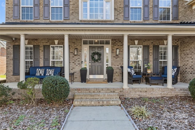 doorway to property featuring a porch