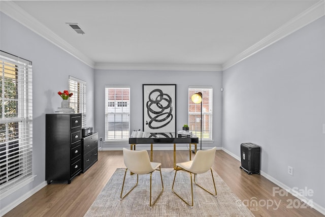 home office featuring wood-type flooring and ornamental molding