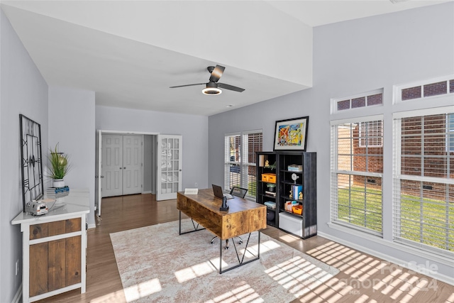 office area with ceiling fan, a healthy amount of sunlight, and hardwood / wood-style flooring