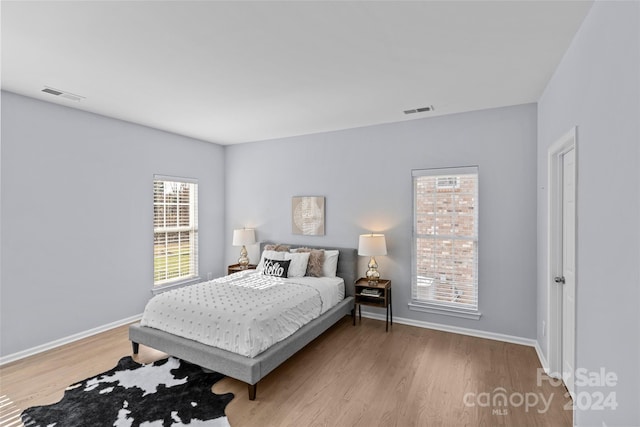 bedroom with light hardwood / wood-style flooring