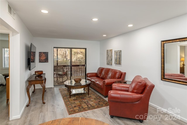 living room with light hardwood / wood-style floors