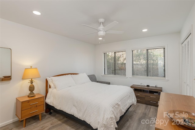 bedroom featuring a closet, ceiling fan, and dark wood-type flooring