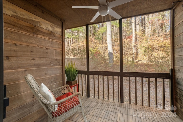 unfurnished sunroom with wood ceiling