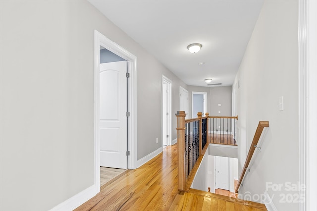 hall with light hardwood / wood-style flooring