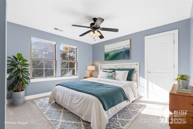 carpeted bedroom with ceiling fan