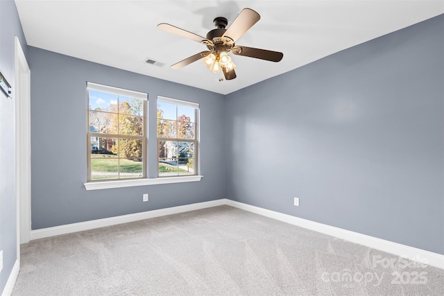 carpeted empty room featuring ceiling fan