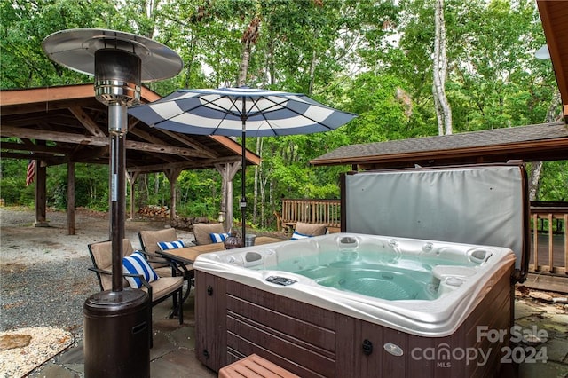 view of patio with a gazebo and a hot tub