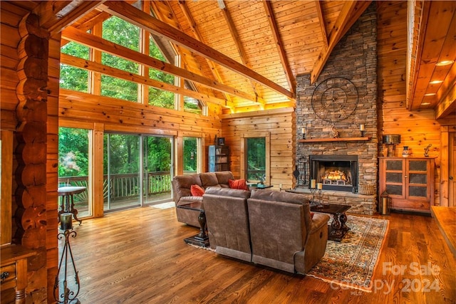 living room with hardwood / wood-style floors, high vaulted ceiling, wood ceiling, and plenty of natural light