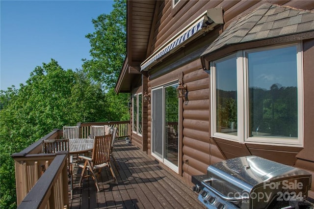 wooden terrace featuring area for grilling