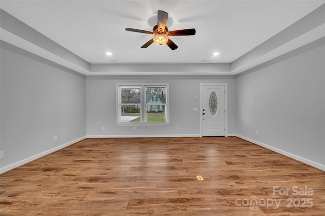 foyer entrance with recessed lighting, a ceiling fan, baseboards, and light wood-type flooring