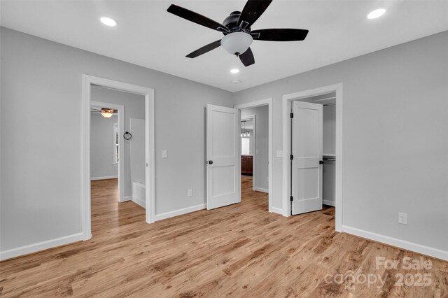 unfurnished bedroom featuring recessed lighting, baseboards, and light wood-style floors