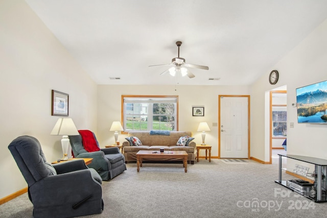 living room with ceiling fan, light carpet, and vaulted ceiling