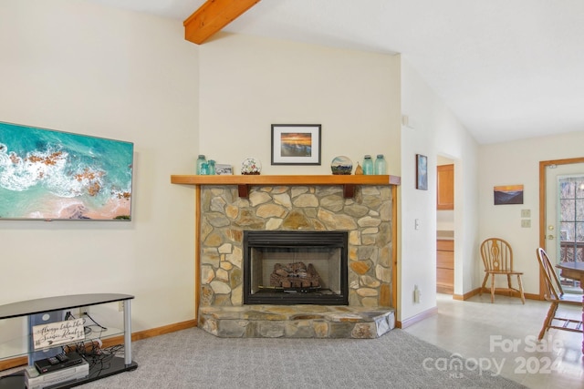 living room with lofted ceiling with beams and a fireplace