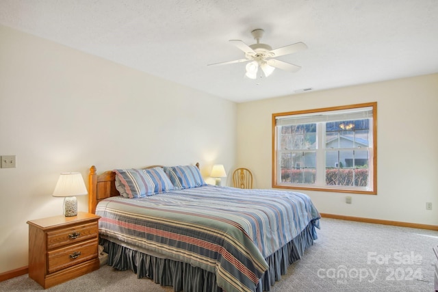 carpeted bedroom with ceiling fan