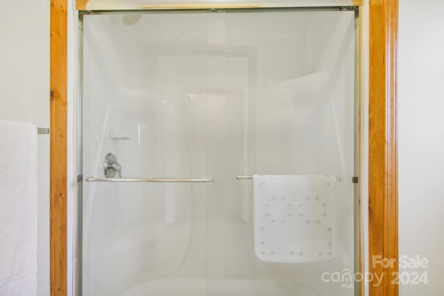 bathroom with an enclosed shower