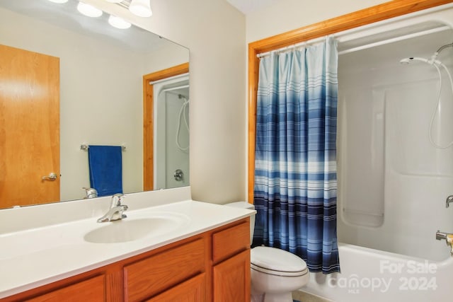 full bathroom with vanity, toilet, and shower / tub combo with curtain