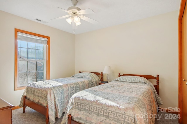 carpeted bedroom with ceiling fan