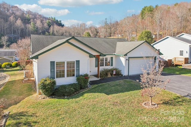 ranch-style home featuring a garage and a front yard