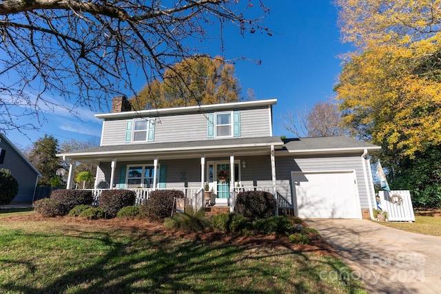 front of property featuring a garage and a front lawn