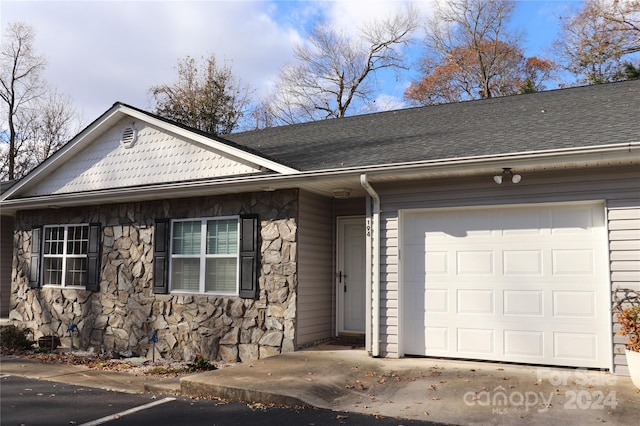 single story home featuring a garage