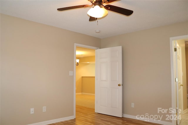 unfurnished bedroom featuring light hardwood / wood-style floors and ceiling fan