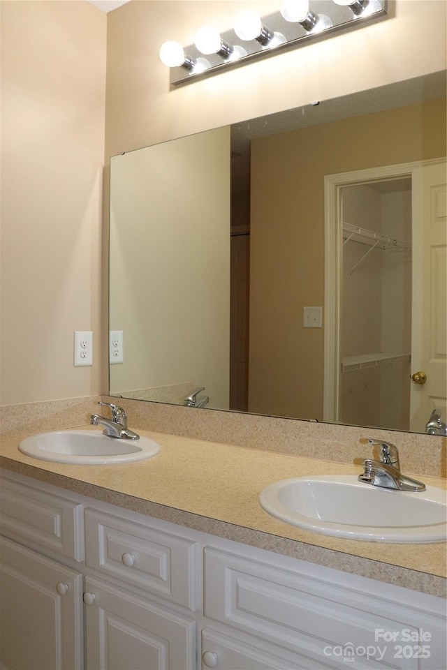 bathroom with double vanity and a sink