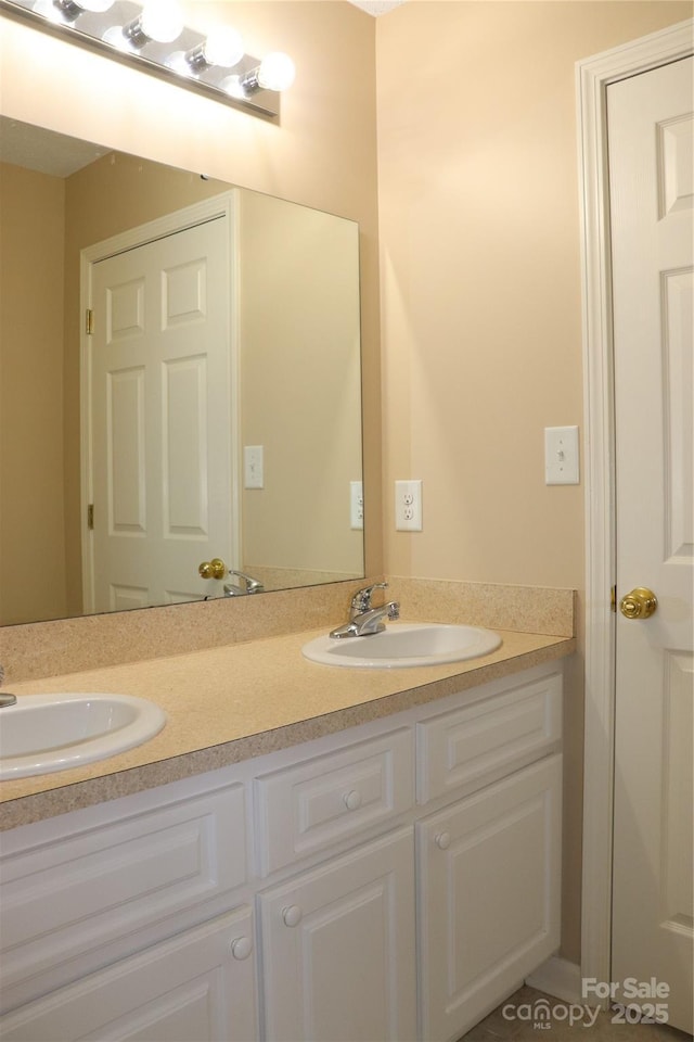bathroom featuring double vanity and a sink