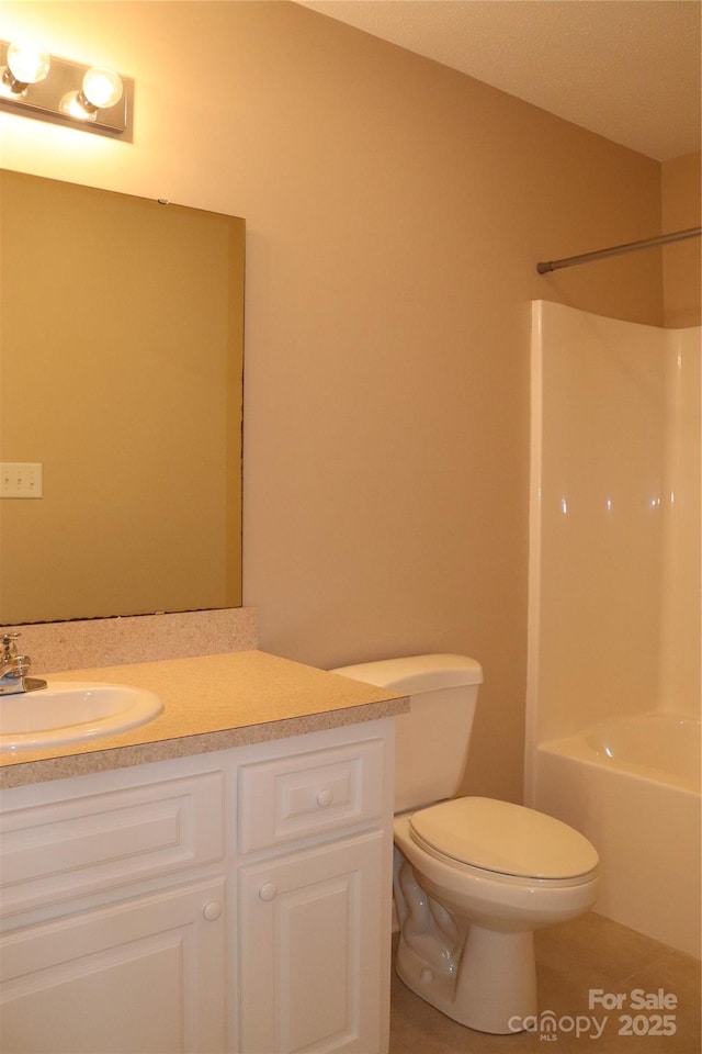 bathroom featuring shower / tub combination, toilet, tile patterned flooring, and vanity