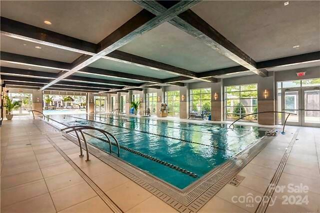 view of pool featuring french doors